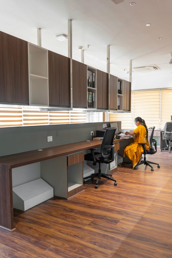 Elegant office workspace featuring a professional woman working at her desk.